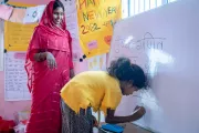 SAGE participant writing on the white board in one of the sessions