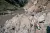 A caravan of mules navigates narrow, difficult paths through the rugged mountains of Dolpa District, transporting various supplies, including life-saving Ready-to-Use Therapeutic Food (RUTF) - provided by the US Government to Nepal through UNICEF - to the remote Kaike Municipality. 