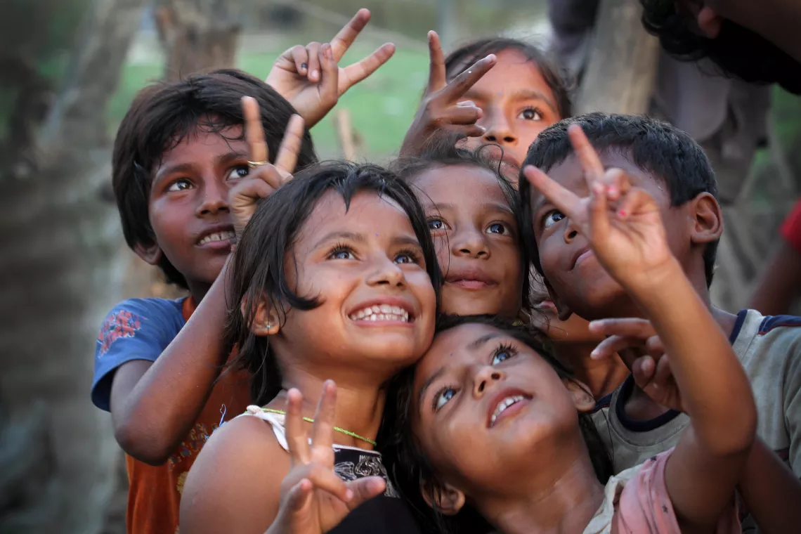 The children with happy moods after UNICEF distributing Relief Materials at Ramailo Basti,Chitwan .