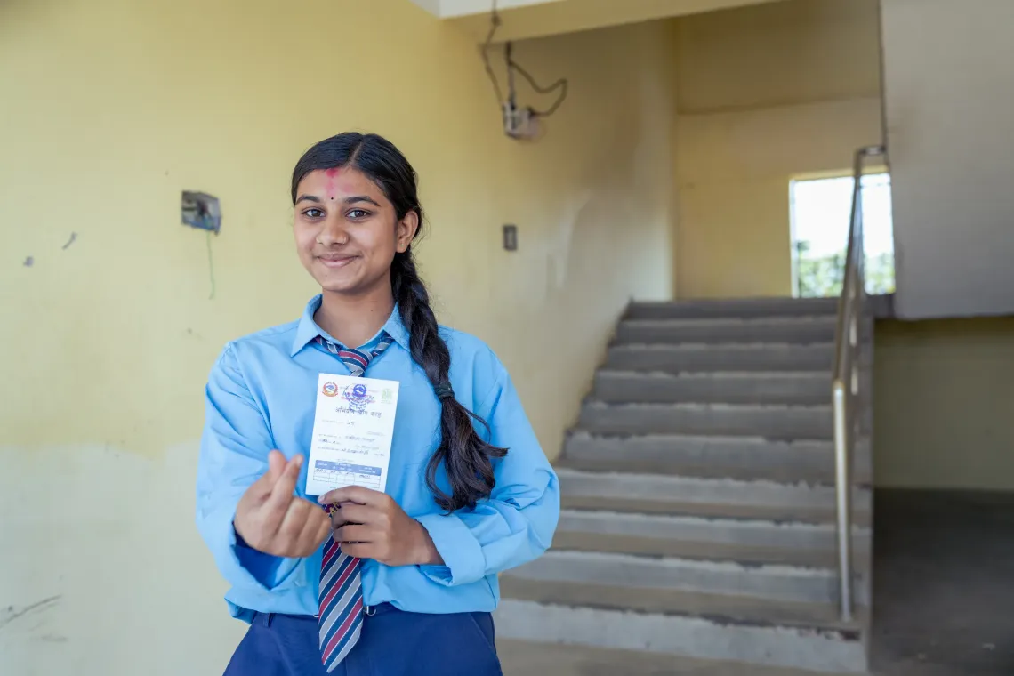 Sangita Khanal, 16 years old girl from Shree Adarsha Namuna Madhyamik Vidyalaya from Lalmatiya, Deukhuri poses after receiving the HPV vaccine.
