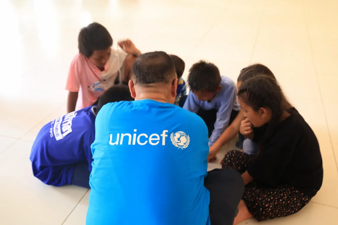 Children taking part in a UNICEF-led group session