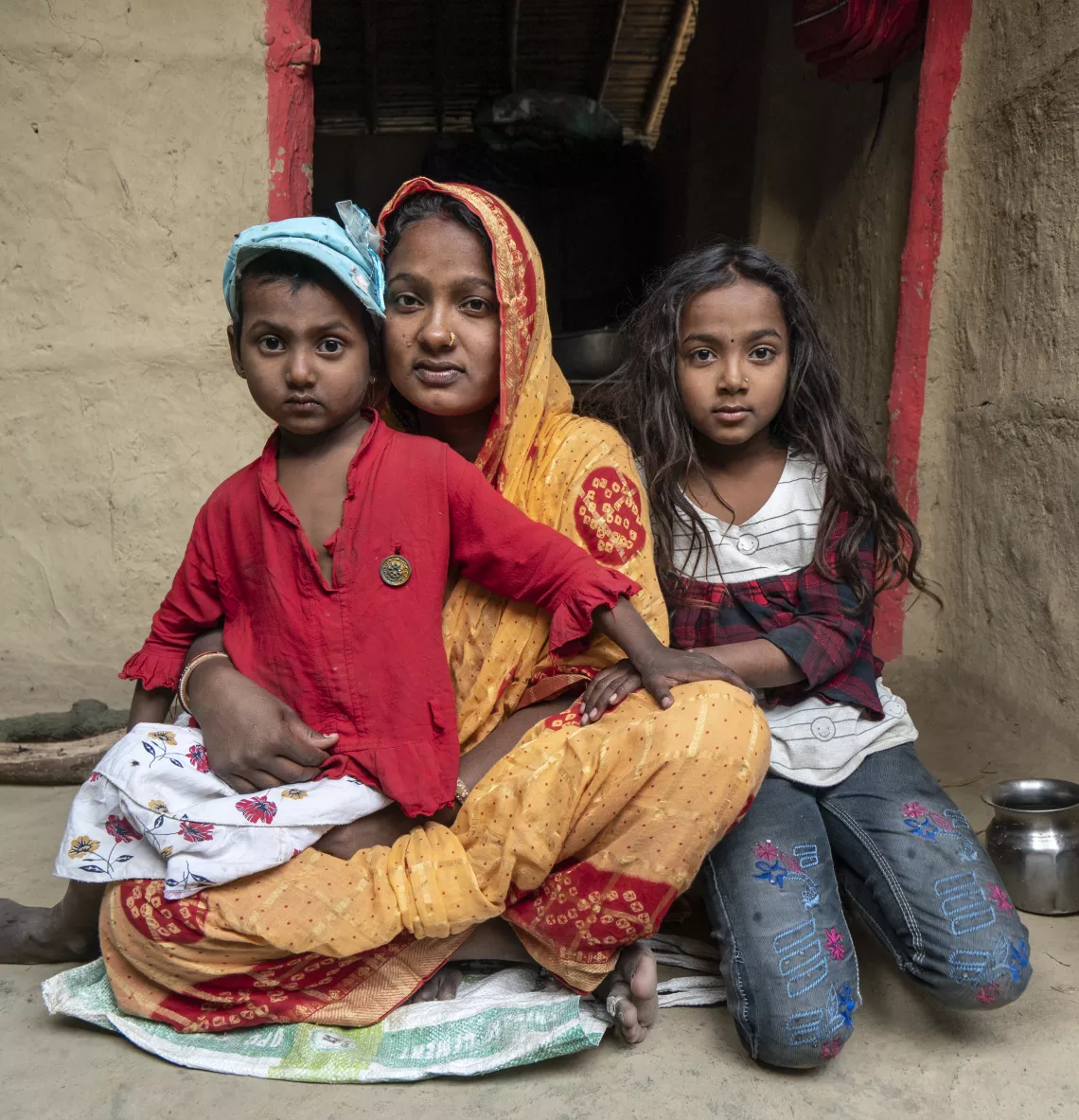 Rakhi with her two children at their home