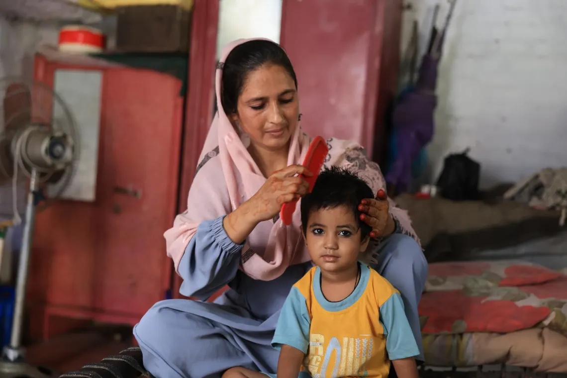 Sabina combining her granddaughter hair 