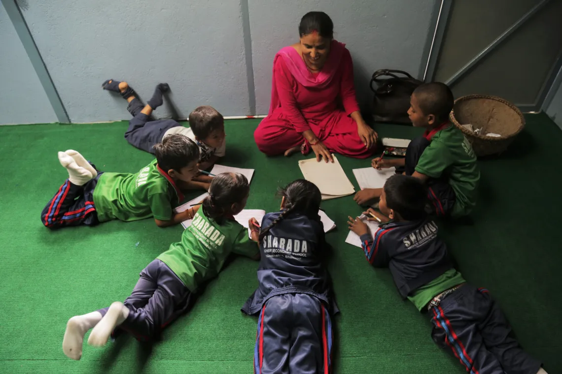 Indira with teachers