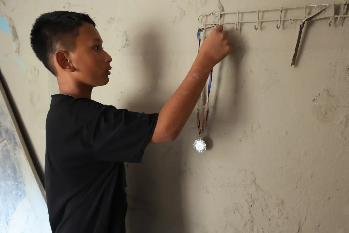 On 21 September 2026, Susin, 12, is in his flood-affected neighbourhood in Nuwakot, 