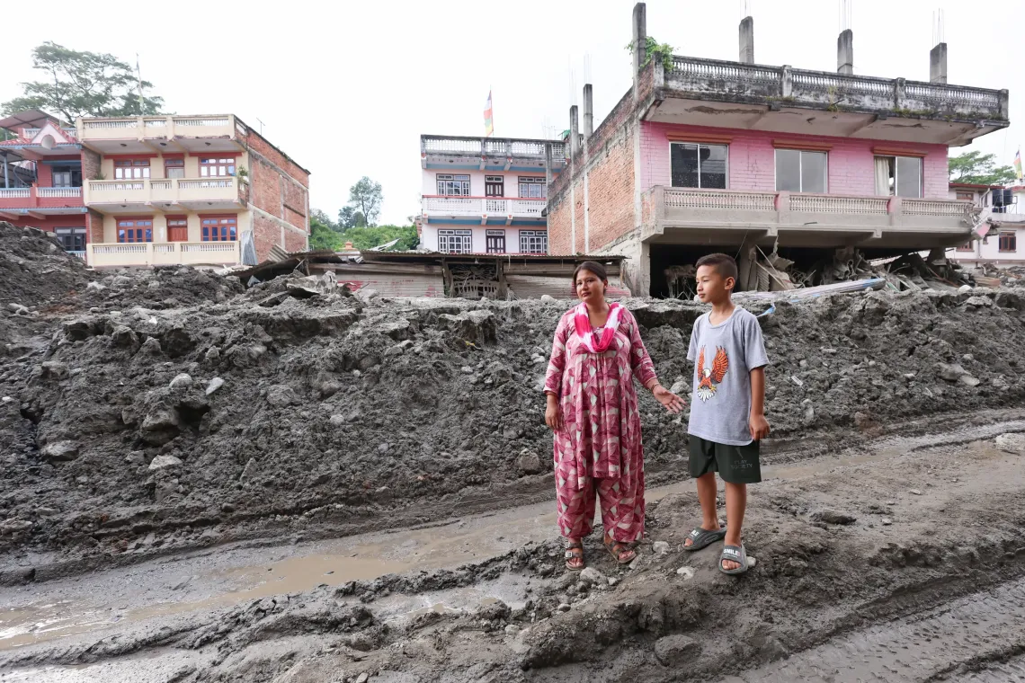On 21 September 2026, Swastik (10) and his mother, Sailaja, a primary teacher at Tribhuvan Trishuli Secondary School, in their flood-affected neighbourhood in Nuwakot, Nepal.