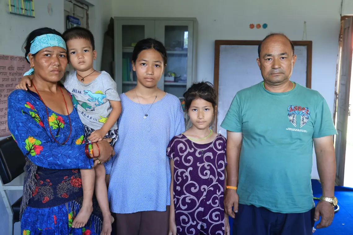 On 27 August 2026, (from left to right) Bhagawati Nagarkoti with her children Sajan (3), Sonika (13) and Monika (9) and husband Som Bahadur. The family of five have been sheltering in school in Nuwakot District, Bagmati Province, Nepal, after floods destroyed their homes and surrounding areas. Heavy flash floods swept through central northern Nepal on 26 August, causing widespread destruction to homes, roads and other infrastructure.