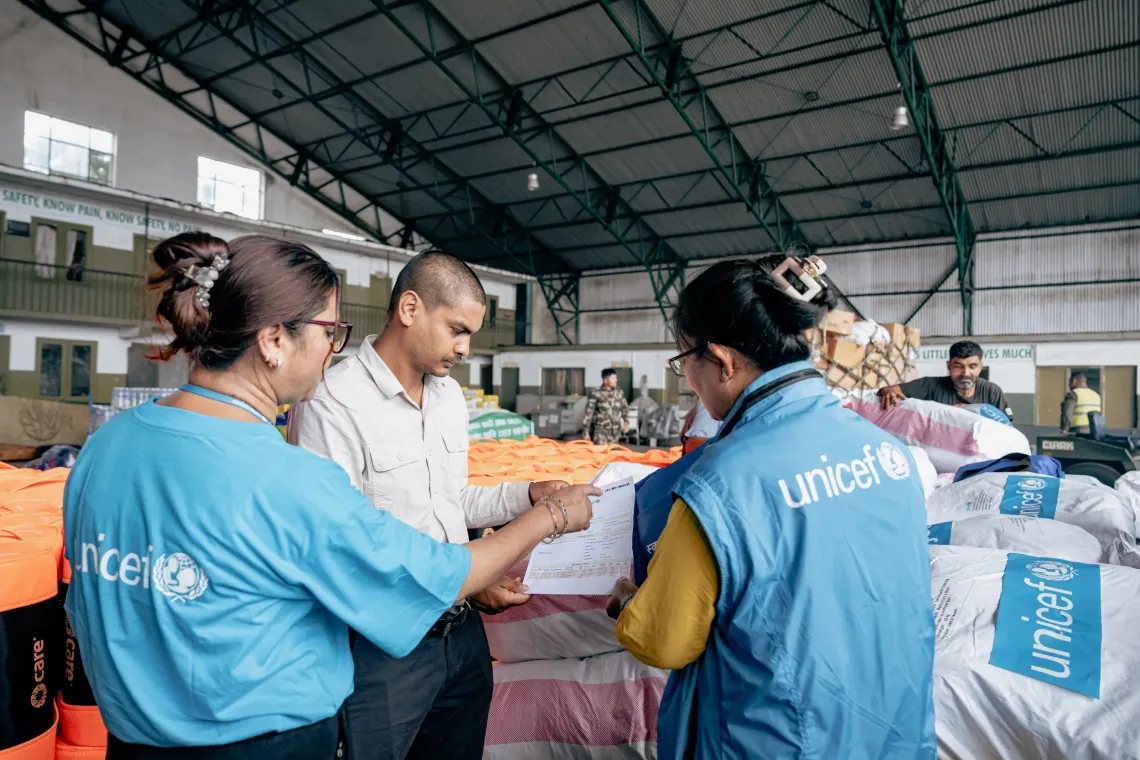 UNICEF staff load pre-positioned hygiene kits at the Humanitarian Staging Area in Kathmandu for delivery to flood-affected communities in Rasuwa, Nuwakot and Dhading Districts to support children and families affected by the devastating floods, helping meet immediate hygiene and sanitation needs during the emergency.