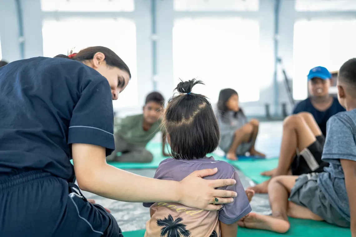 On 10 September 2026, children take part in a group psychological first aid session at a UNICEF-supported medical tent in Nuwakot District, Bagmati Province, Nepal.