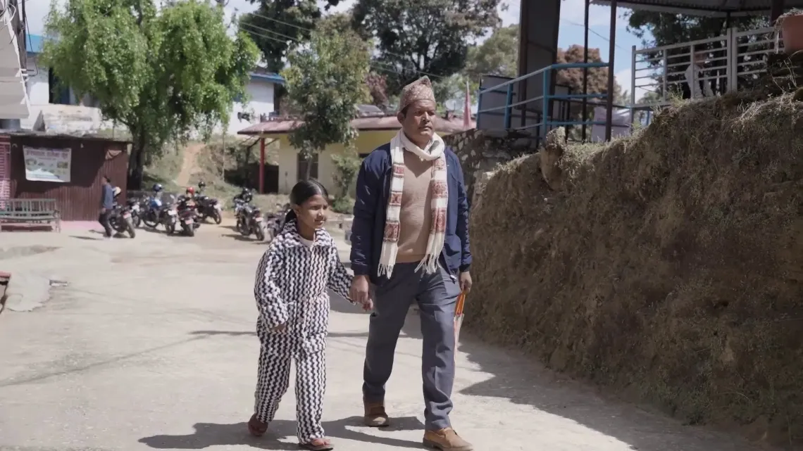 Sarita with her father walking together to visit hospital