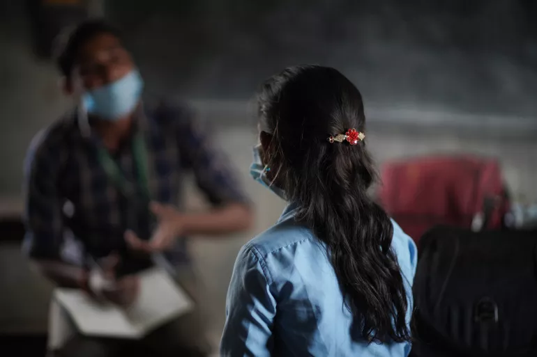 This image shows a girl taking part in a counselling session at her school