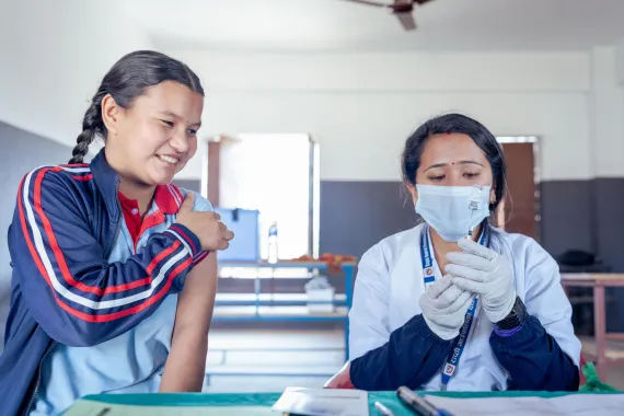 A photo of a young girl getting vaccinated with the HPV vaccine.
