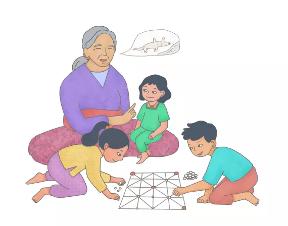 This image shows children with their grandmother listening to stories and playing with stones