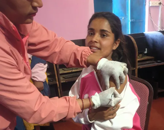 A photo of Pushpa getting vaccinated with the HPV vaccine.