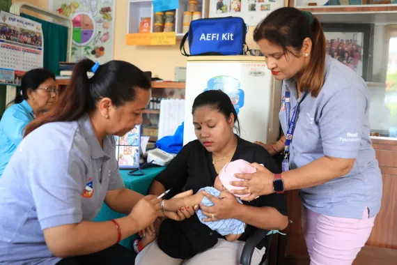 Bimala (right) during a vaccination campaign at the local health post. 