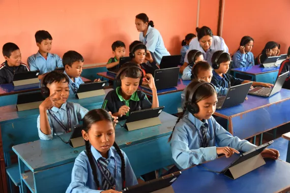 Photo of classroom where students are learning to use tablet for studying