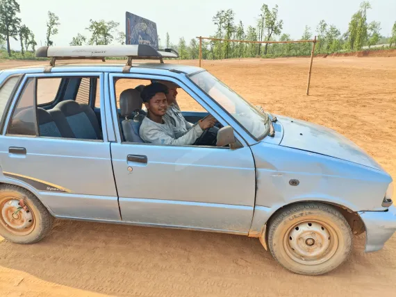 Mahendra learning to drive during training. 