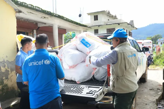 Emergency supplies are transported by vehicle to support flood-affected families and communities.