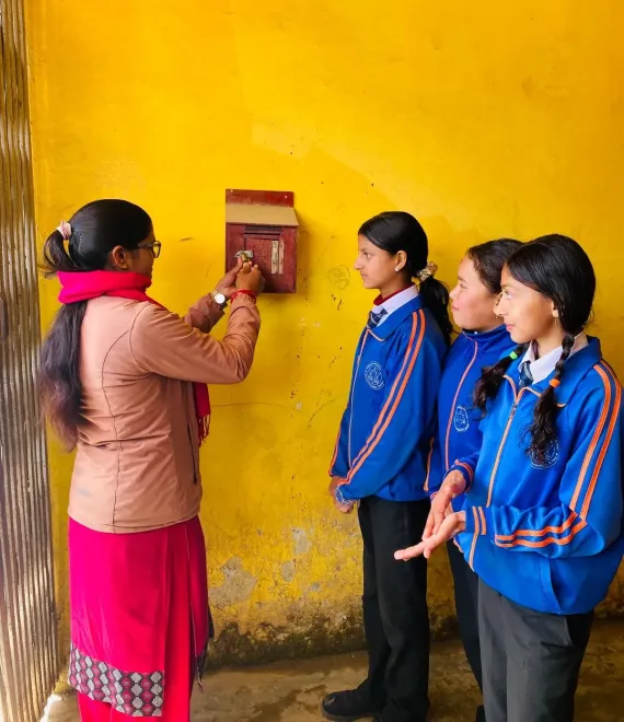The head teacher opens the Complaint Box with the student CRM committee.