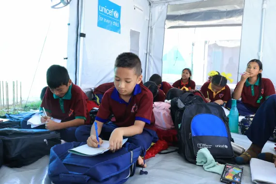 On 22 September 2026, Swastik and his friends return to learning at a UNICEF-supported temporary learning centre at Tribhuvan Trishuli Secondary School in Nuwakot, Nepal, after devastating floods damaged classrooms and disrupted education in the community. 
