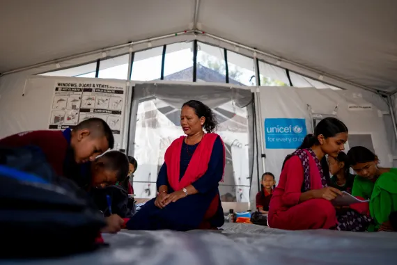 On 22 September 2026, Sita, a mathematics teacher at Tribhuvan Trishuli Secondary School, teaches students as they return to learning at a UNICEF-supported temporary learning centre at the school in Nuwakot.,