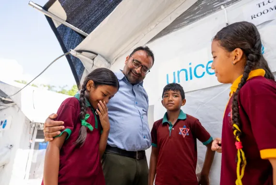 On 22 September 2026, Rajendra Dawadi, Principal, talks with his students at a UNICEF-supported temporary learning centre at Tribhuvan Trishuli Secondary School in Nuwakot, Nepal. 