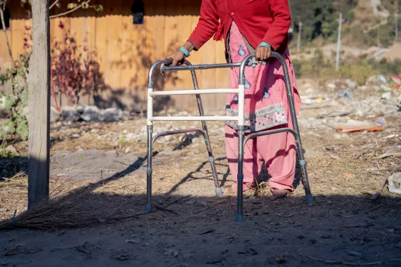 a girl walking with the help of a walker