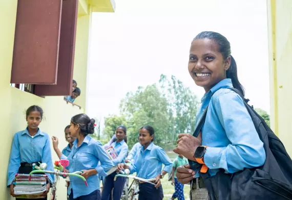 Laxmi in her school with other students in the background