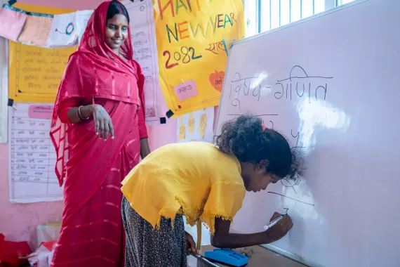 SAGE participant writing on the white board in one of the sessions