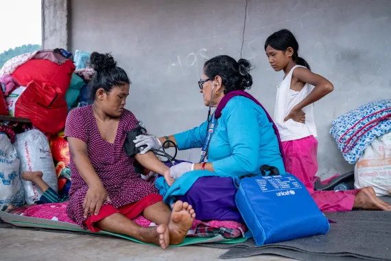 On 4 September 2026, Kamala Adhikari, Senior Auxiliary Nurse Midwife, checks on Nanu Maya and her newborn during a postnatal care (PNC) visit at a holding centre in Bidur Municipality, Nuwakot, Bagmati Province, Nepal.