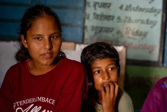 On 13 September 2026, Manisha with a young child at a holding centre at Chandra Jyoti Secondary School in Bidur Municipality, Nuwakot District, Nepal.
