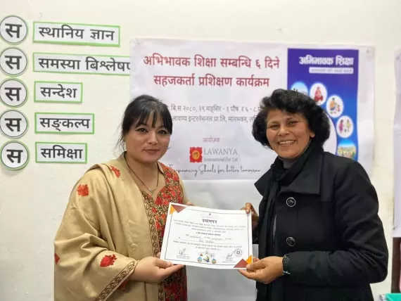 one woman awarding other with participation certificate