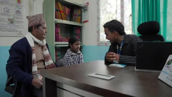 Sarita's father and Sarita in PEN Plus clinic 
