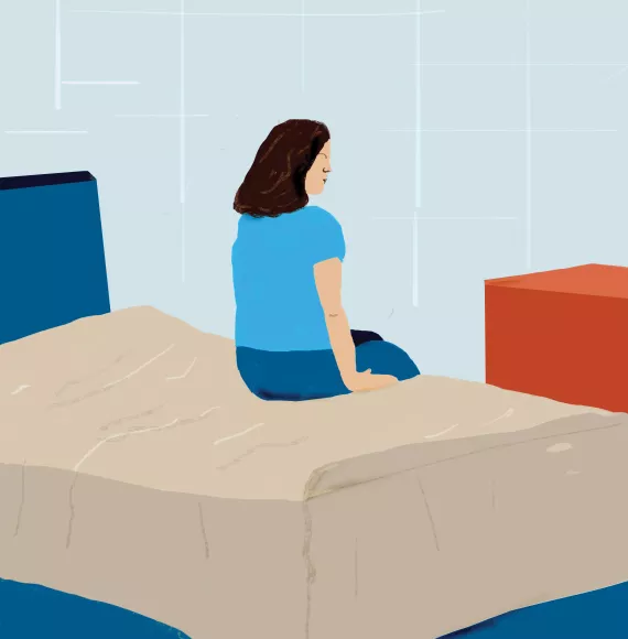 This image shows an illustration of a person sitting on a bed