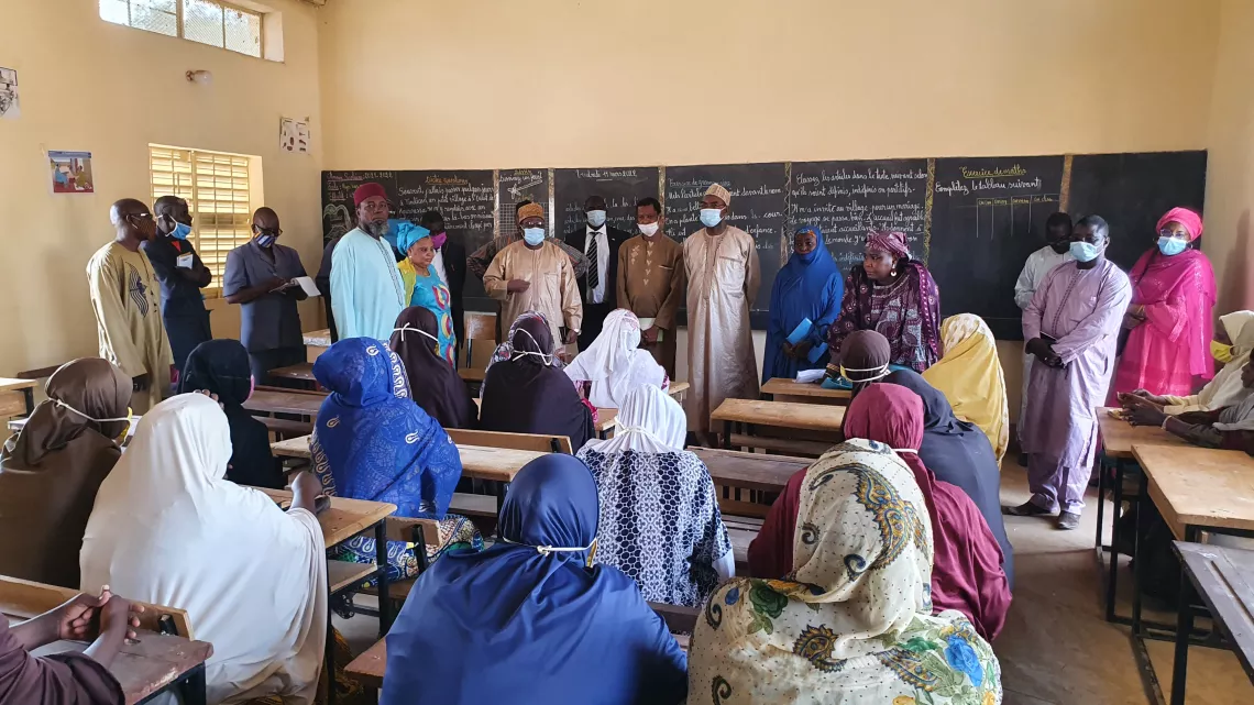 The Education Minister addresses teachers in one of the new classrooms. 