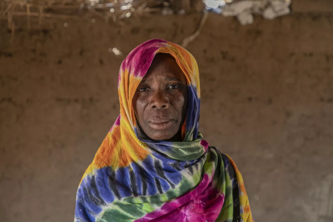 Portrait of Ms. Ami Wandura with a colorful headscarf. 