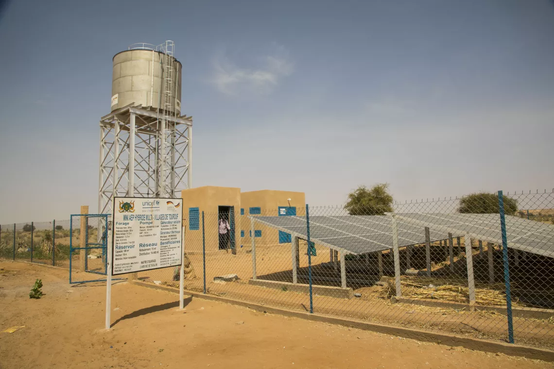 Entrance of the pumping station with visibility sign with technical specifications of the station.
