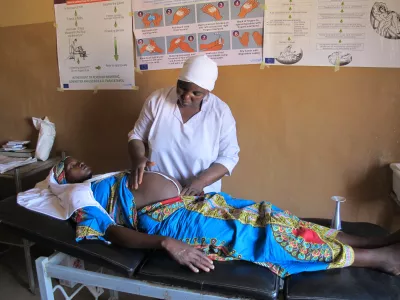 A pregnant woman receiving antenatal care at a primary healthcentre.