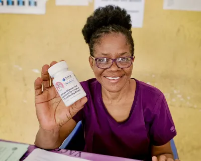 Nurse Holding MMS Bottle