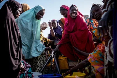Women getting water from a tap