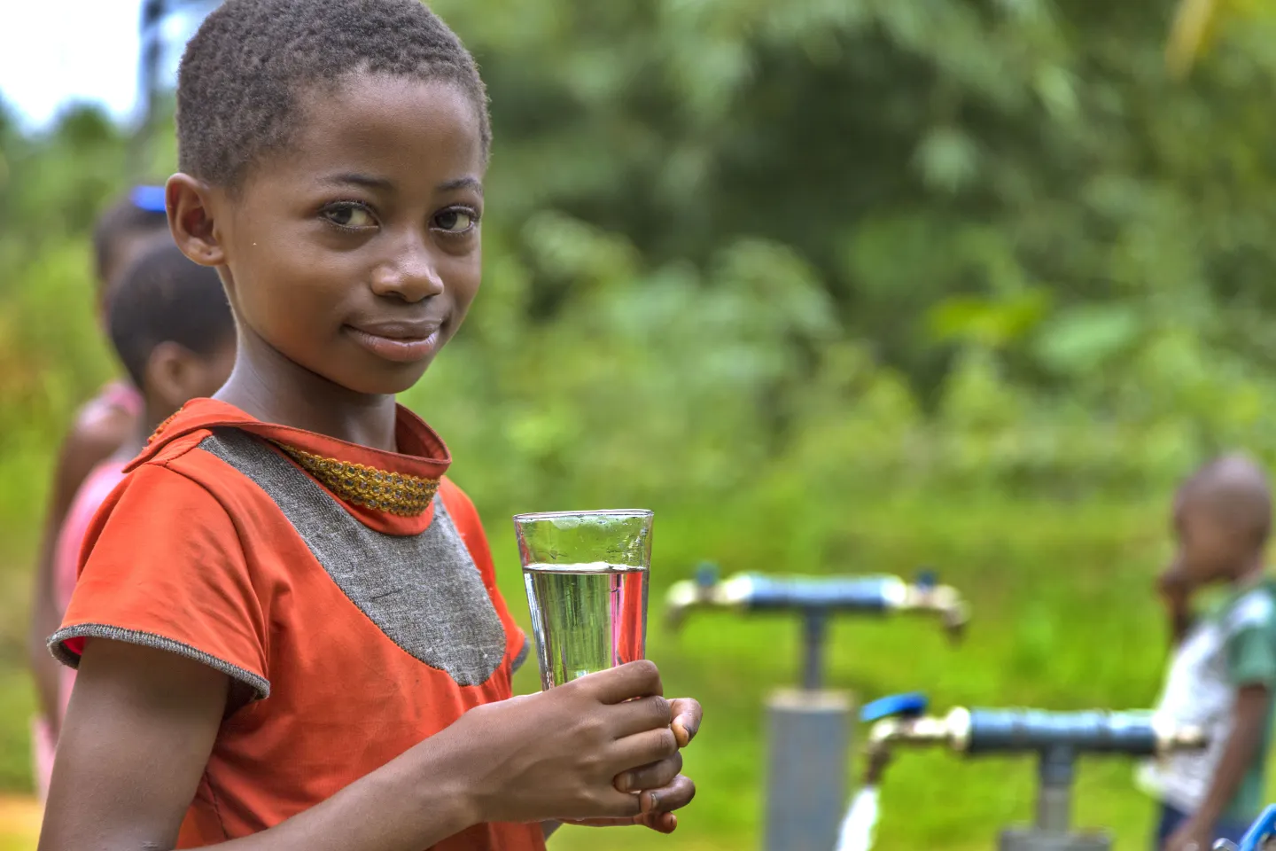 A girl with a glass of water