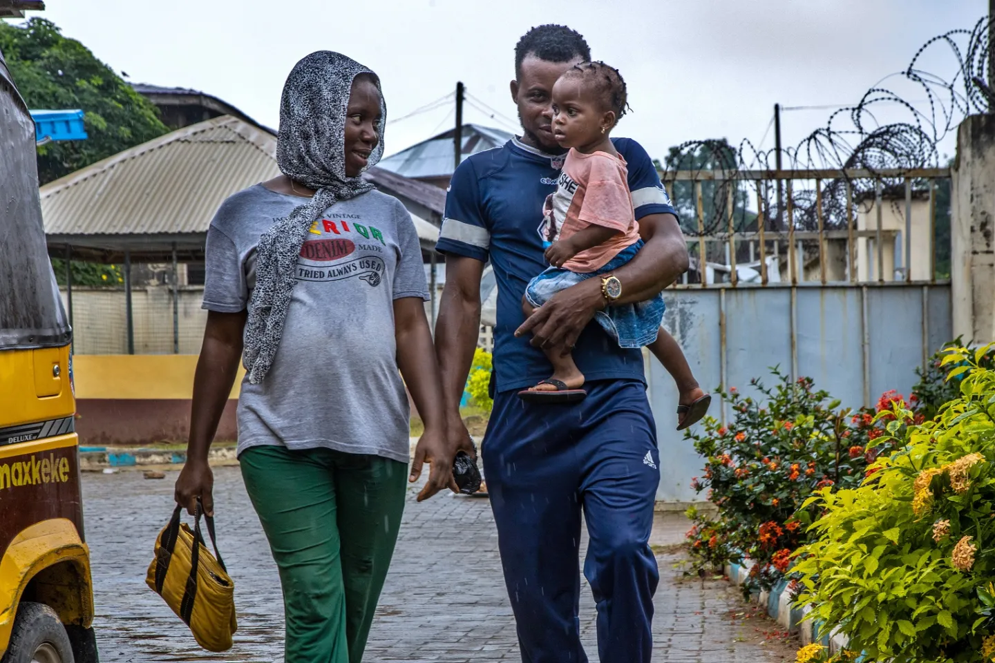 Pregnant wife and husband carrying another child 