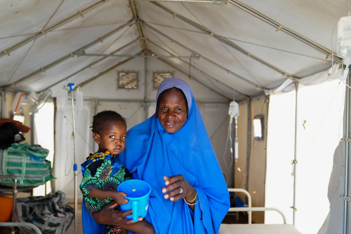 A woman holding a child