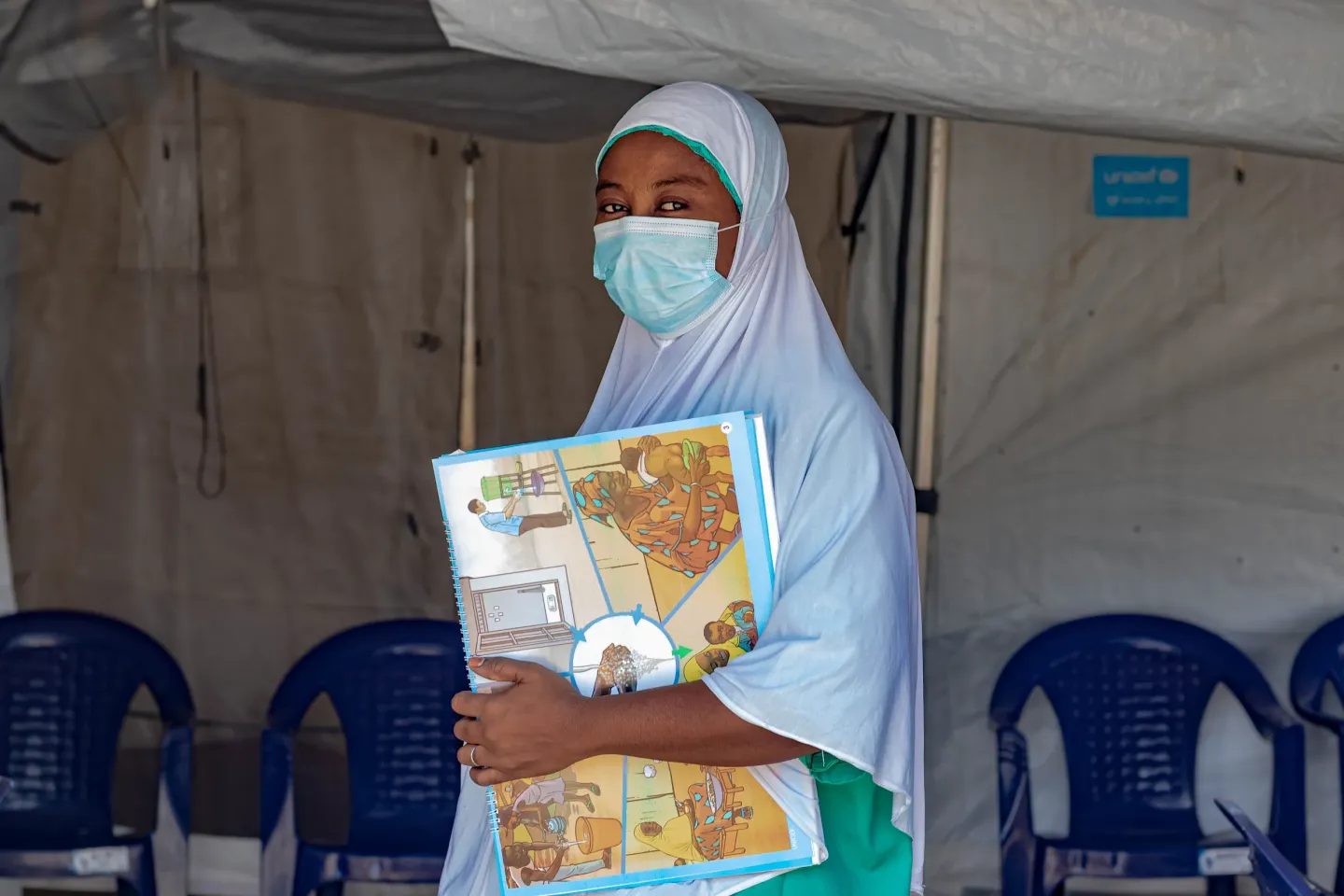 A health care worker's pose for a photo
