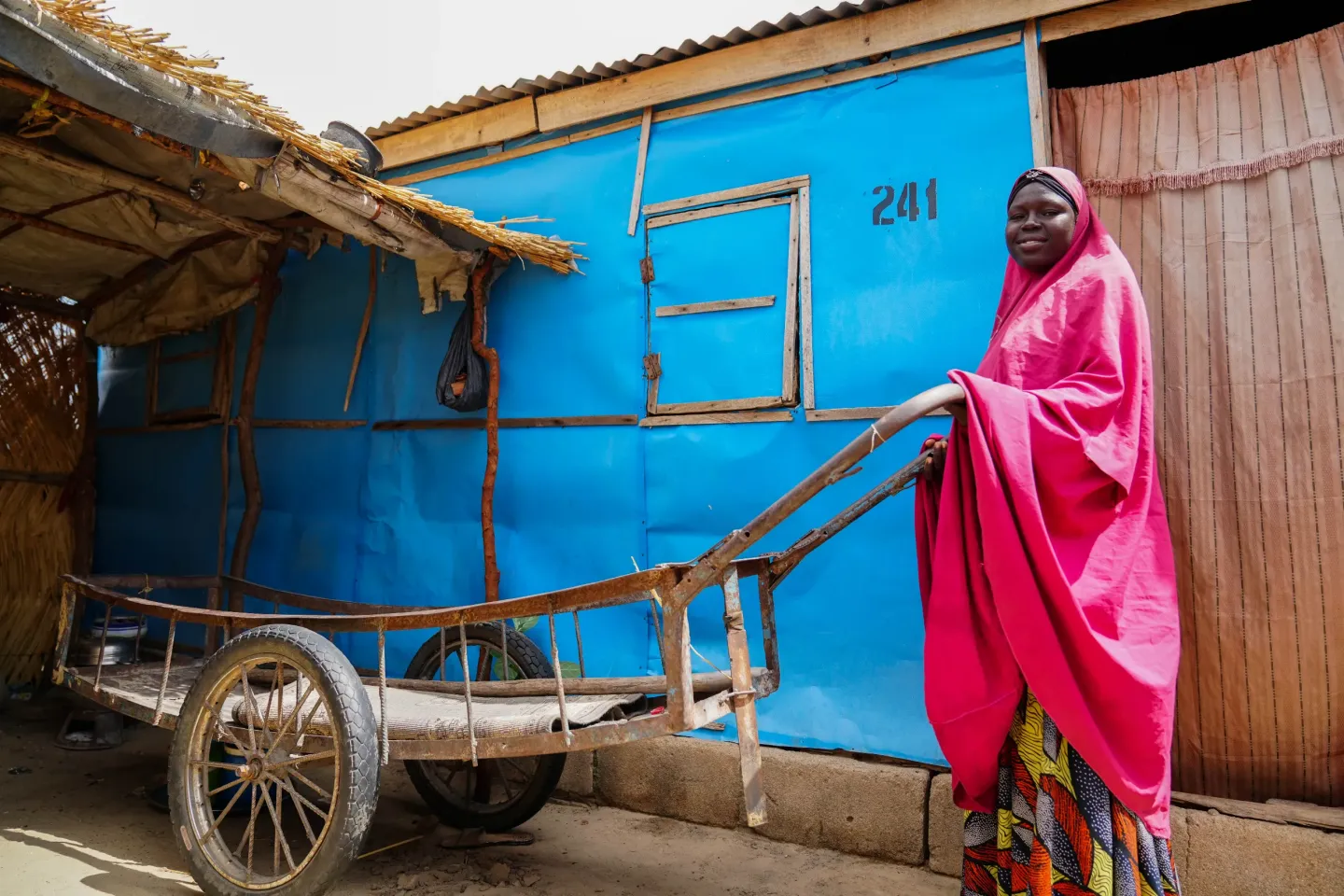 A woman pushing a cart