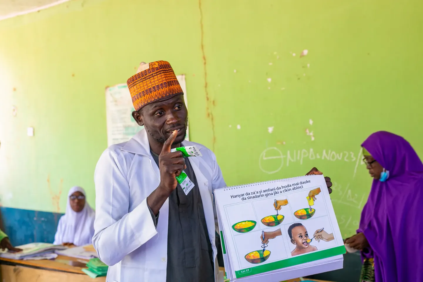 A health worker teaching mothers on good nutrition