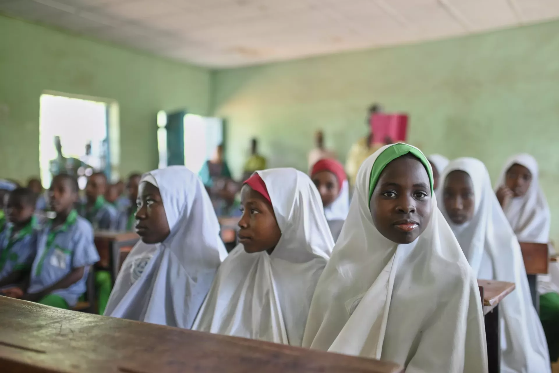 Adolescent girls sitting in a classroom 