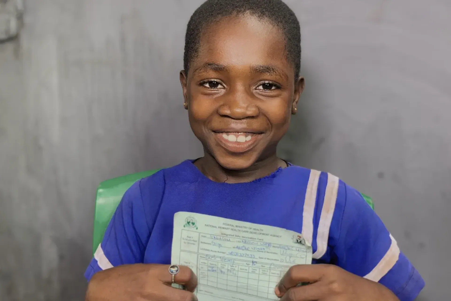 A girl with her vaccination card