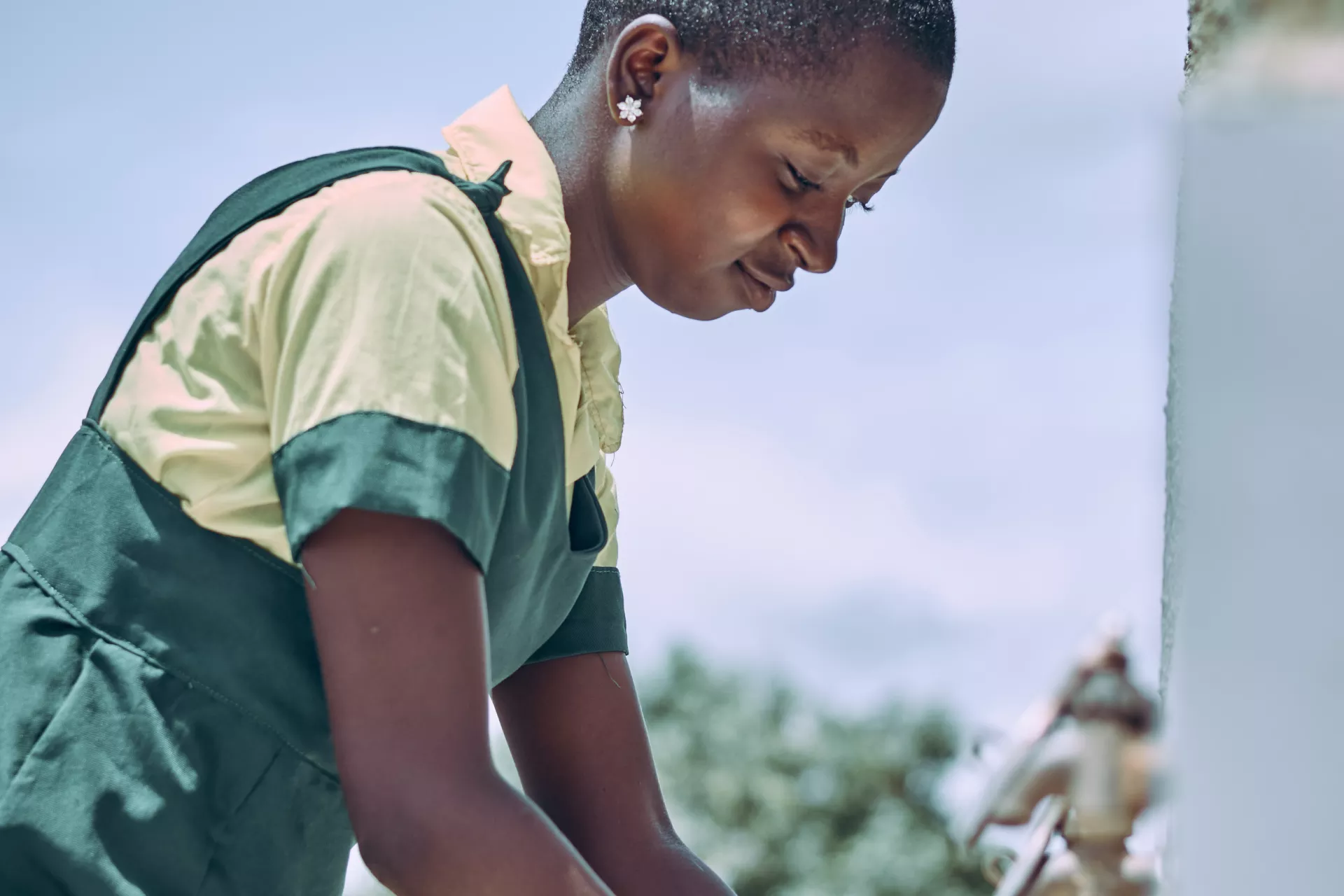  A girl washing her hands 