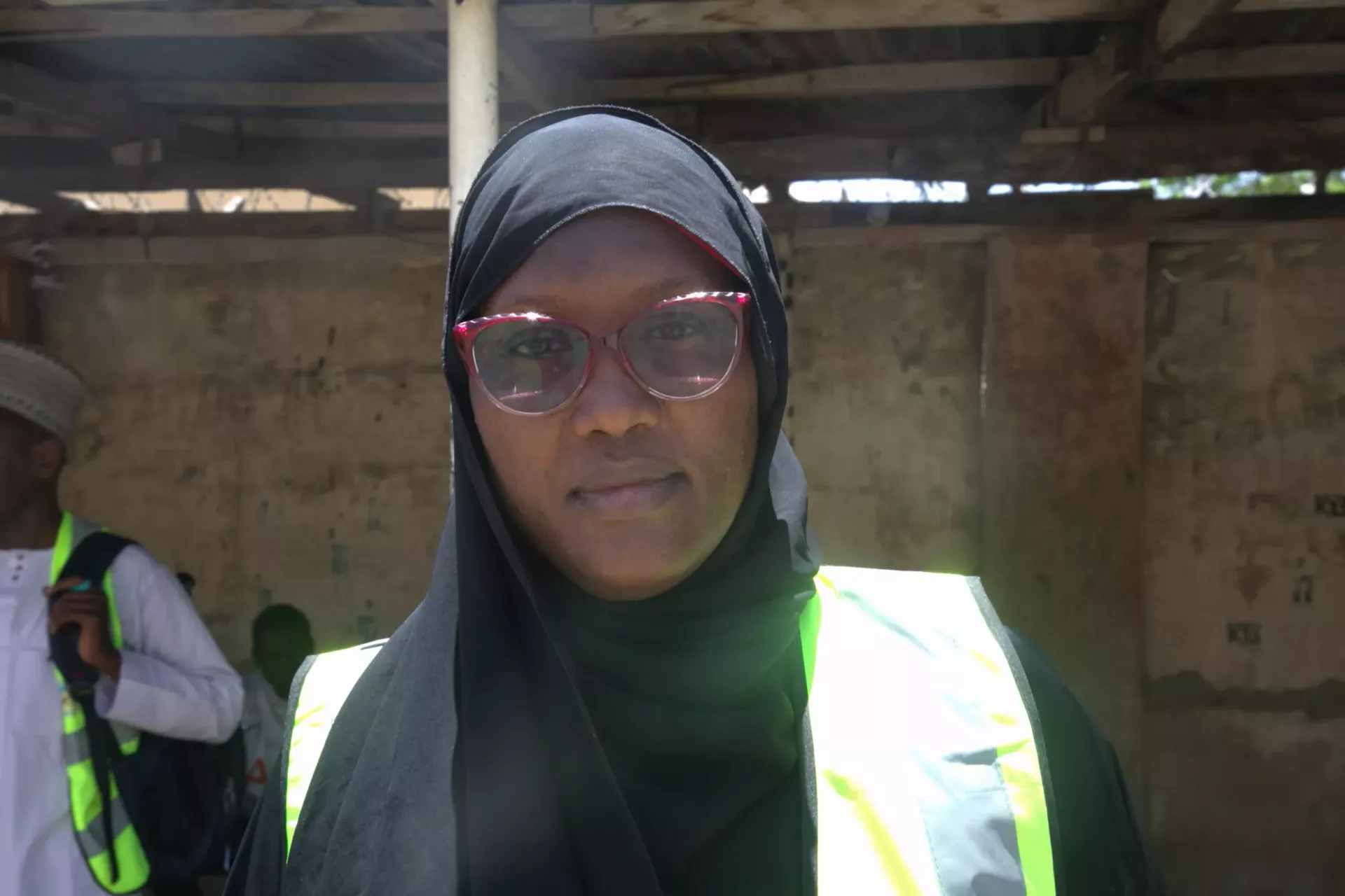 A woman standing in front of camera. 
